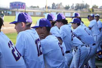 The Tigers look on Wednesday in Lemoore's home game against Dinuba High School.